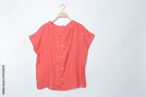 Pink blouse with summer blouse cotton on white background. © Pornpawit