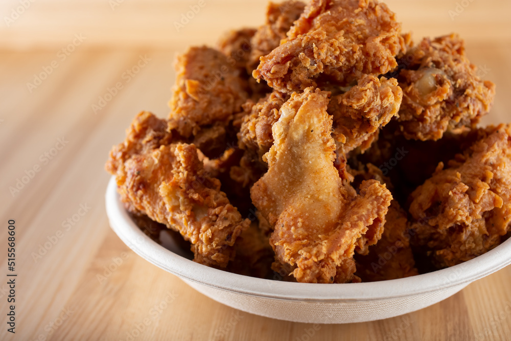 A view of a bowl of deep fried chicken wings. A view of a bowl of deep fried chicken wings.