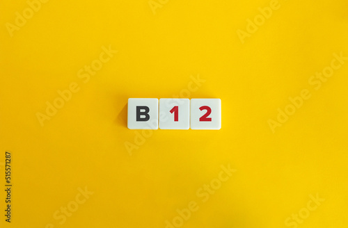 B12 Vitamin. Text on Letter Tiles on Yellow Background. Minimal Aesthetics. photo
