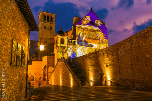 View of Basilica of Saint Francis of Assisi at sunset during christmas time in Umbria Italy