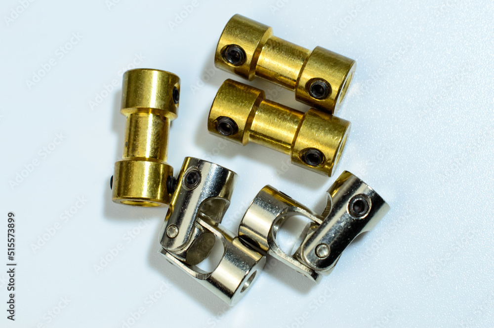 Set of a different couplings for RC model toys. On white background. Selective focus. Set of a different couplings for RC model toys. On white background. Selective focus.