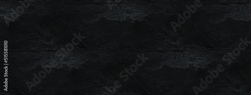 Old wall with irregular pattern. Harsh surface in black tones. Grunge background best for wallpaper. 