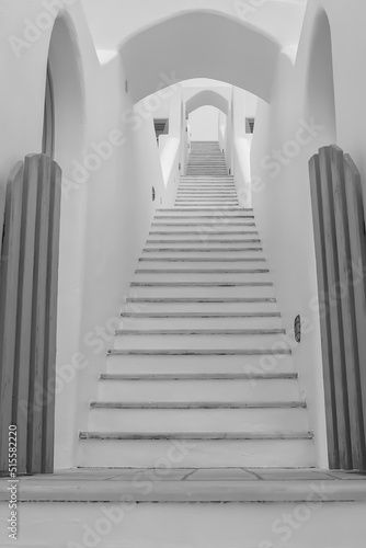 Whitewashed steps of a villa leading upstairs in Imerovigli Santorini in black and white