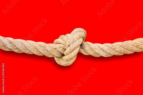 Untie the knots - problem solving concept image on red background