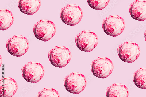 Pattern with raspberry ice cream scoops on pink
