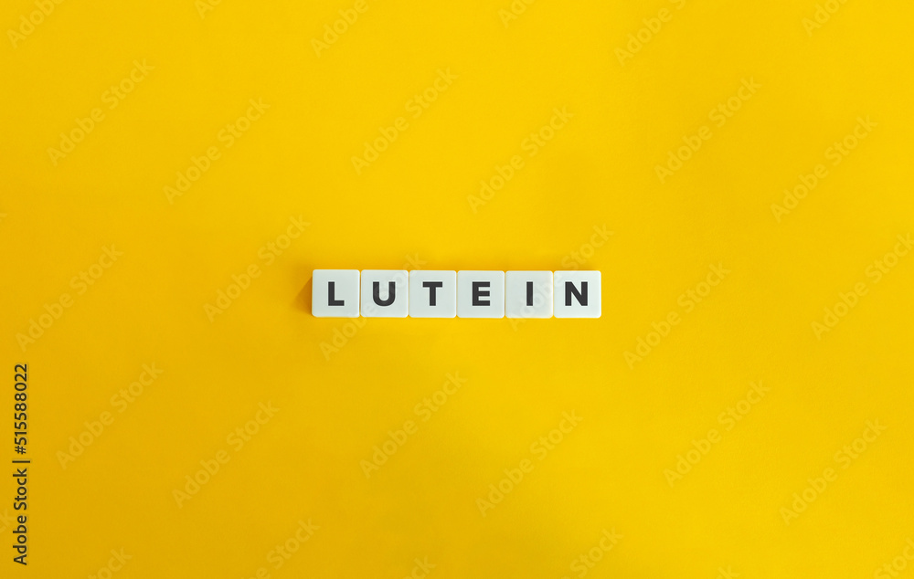 Lutein Word and Banner. Text on Letter Tiles on Yellow Background. Minimal Aesthetics. Lutein Word and Banner. Text on Letter Tiles on Yellow Background. Minimal Aesthetics.