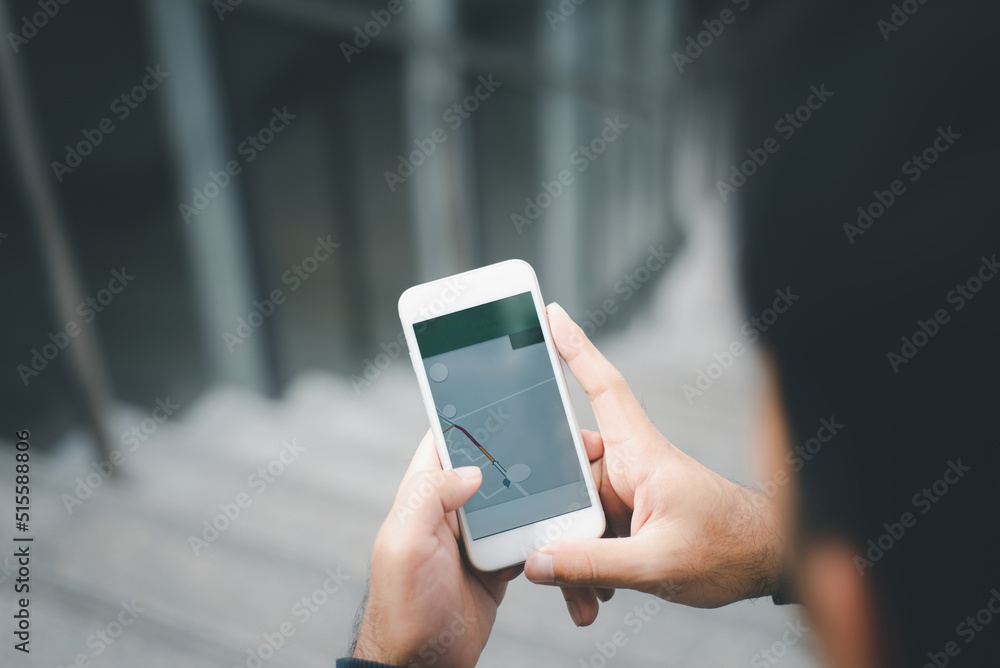 People checking smartphone with GPS navigator on map, Tourist using navigation app on the mobile phone. Freedom and active lifestyle concept People checking smartphone with GPS navigator on map, Tourist using navigation app on the mobile phone. Freedom and active lifestyle concept