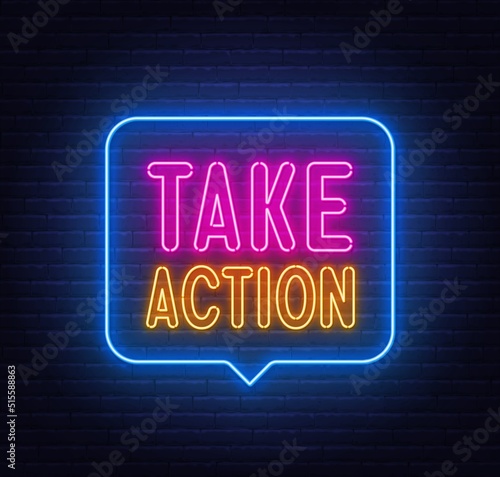 Take Action neon sign in the speech bubble on brick wall background ..