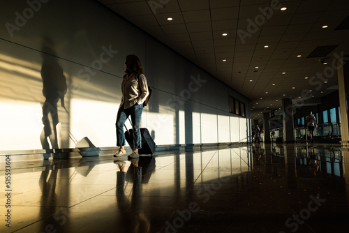 Stockholm,Sweden  A woman walks into the terminal at Arlanda airport. photo