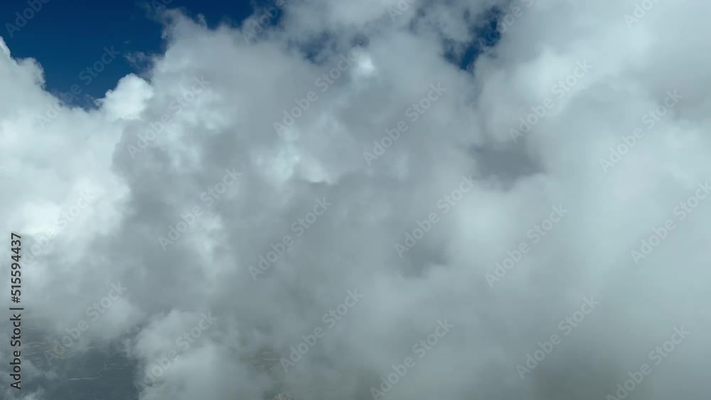 Awesome pilot point of view while flying through white cumulus clouds in a summer and hazy day.4K Awesome pilot point of view while flying through white cumulus clouds in a summer and hazy day.4K