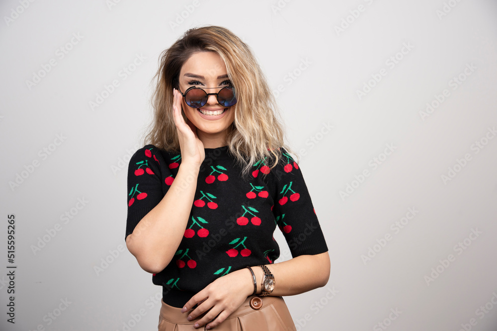 Fototapeta premium Blonde woman with glasses looking at camera