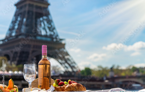 Photography Picnic and wine near the Eiffel Tower. Selective focus.