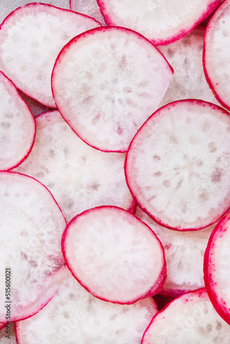 thinly sliced radish up close and full frame