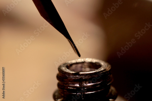 An old and historic Islamic scientist is working in his studio writing, reading and exploring.