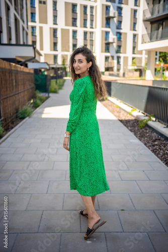 Portrait of young beautiful caucasian brown hair woman posing outdoor in the city