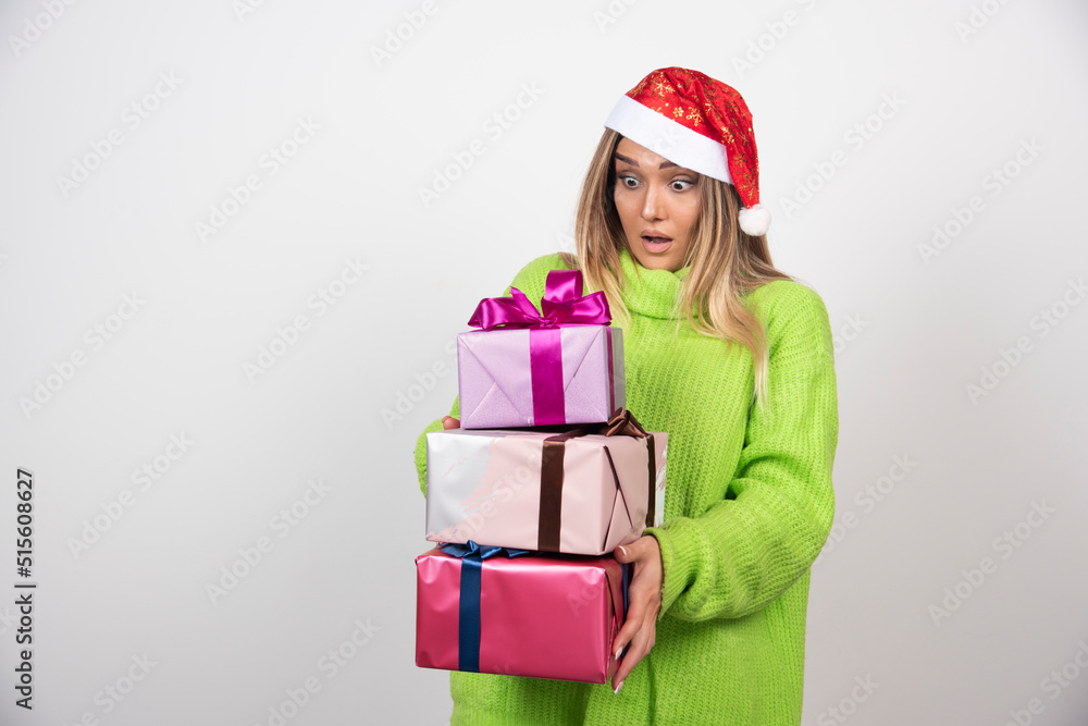 Young woman holding in hands festive Christmas presents