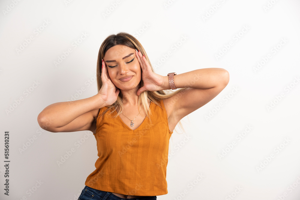Young woman model in casual clothes posing on white background Young woman model in casual clothes posing on white background