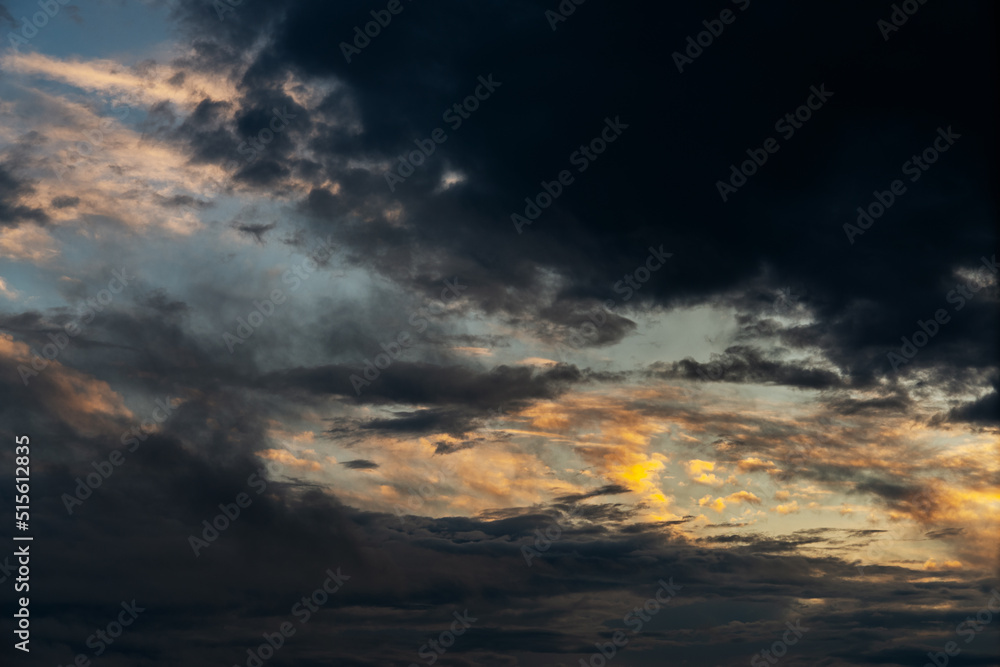 Dramatic sky with orange clouds. Nature background.