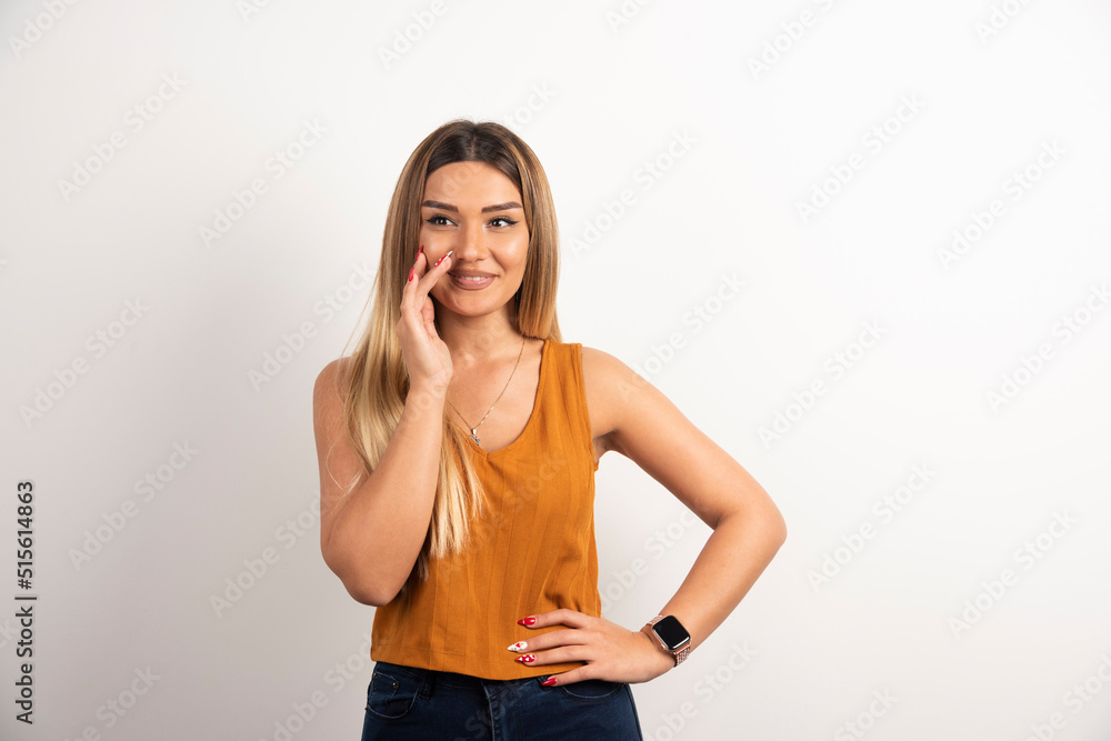 Smiling pretty young adult woman looking at camera and posing Smiling pretty young adult woman looking at camera and posing
