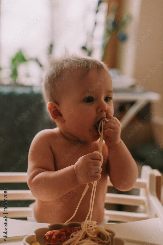 Cute baby eating spaghetti Stock Photo Adobe Stock