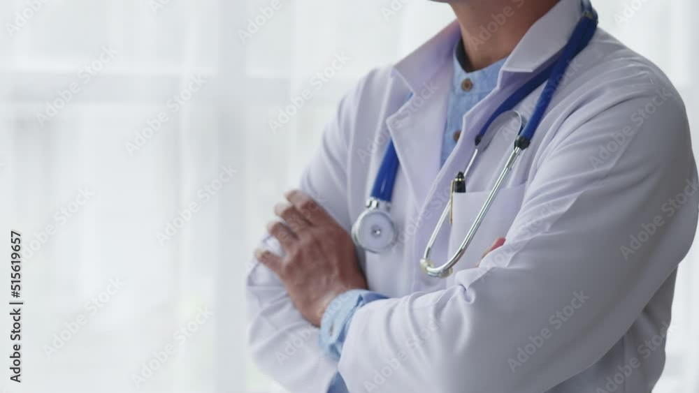 Doctor is standing and cross arm for confident and proud. Doctor is standing and cross arm for confident and proud.
