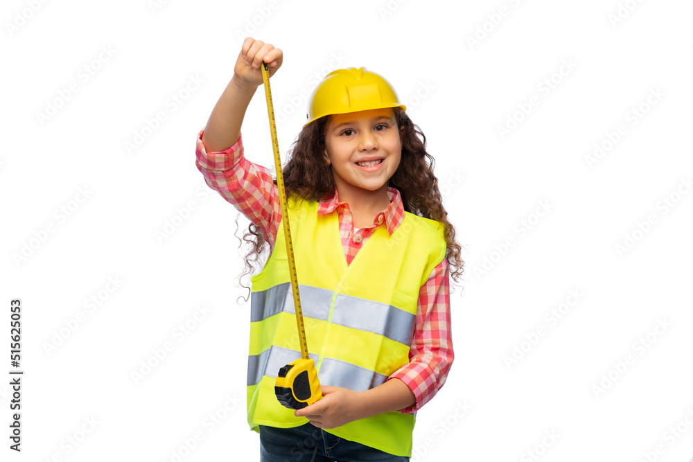 building, construction and profession concept - smiling little girl in protective helmet and safety vest with ruler over white background building, construction and profession concept - smiling little girl in protective helmet and safety vest with ruler over white background