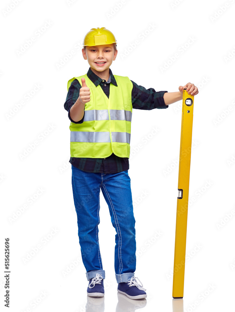 building, construction and profession concept - happy smiling little boy in protective helmet and safety vest with level showing thumbs up gesture over white background building, construction and profession concept - happy smiling little boy in protective helmet and safety vest with level showing thumbs up gesture over white background