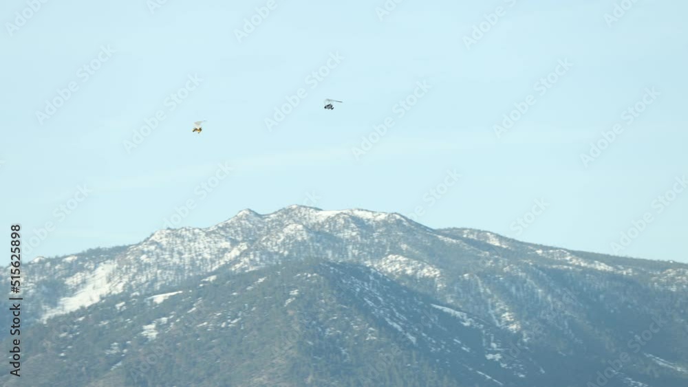 Ultralight flying over the Carson Valley with Snowy Mountains in the background. Shallow Depth of Field Ultralight flying over the Carson Valley with Snowy Mountains in the background. Shallow Depth of Field