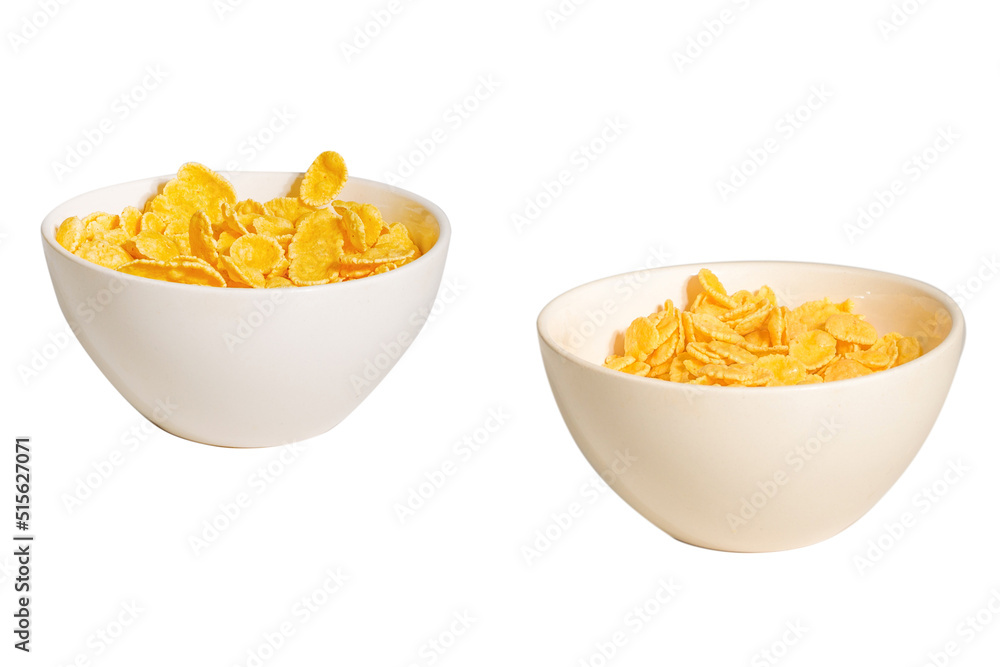 Corn flakes falling to the white bowl. Motion. Corn flakes falling to the white bowl. Motion.