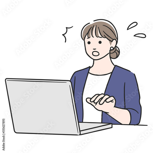 パソコン作業中に驚く女性