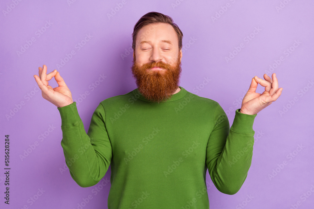 Photo of peaceful relaxing bearded foxy man practice yoga mindfulness open chakras isolated on violet color background