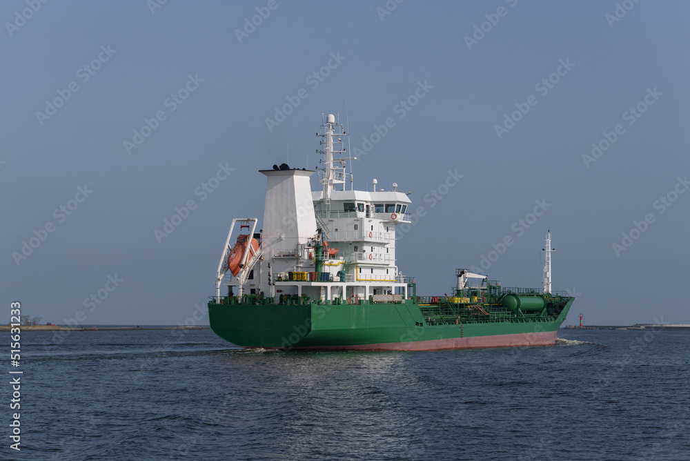 CHEMICAL OIL PRODUCTS TANKER - Ship sails from the port on a cruise to sea
