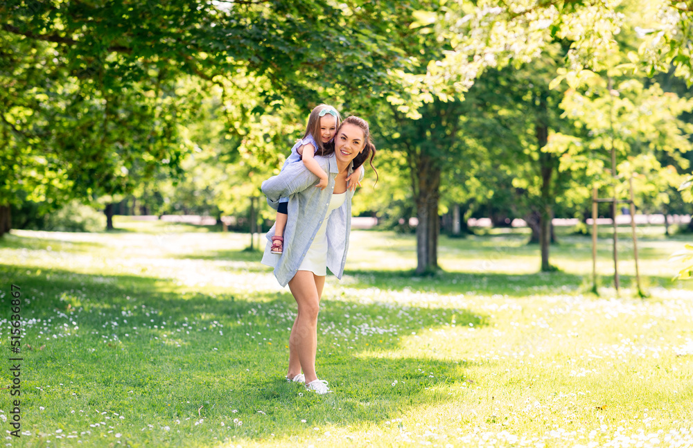 family, motherhood and people concept - happy mother with little daughter having fun at summer park family, motherhood and people concept - happy mother with little daughter having fun at summer park