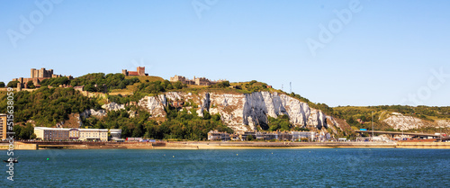 Panoramic view of Dover Castle and White Cliffs of Dover, Kent, UK , with a pale blue clear sky