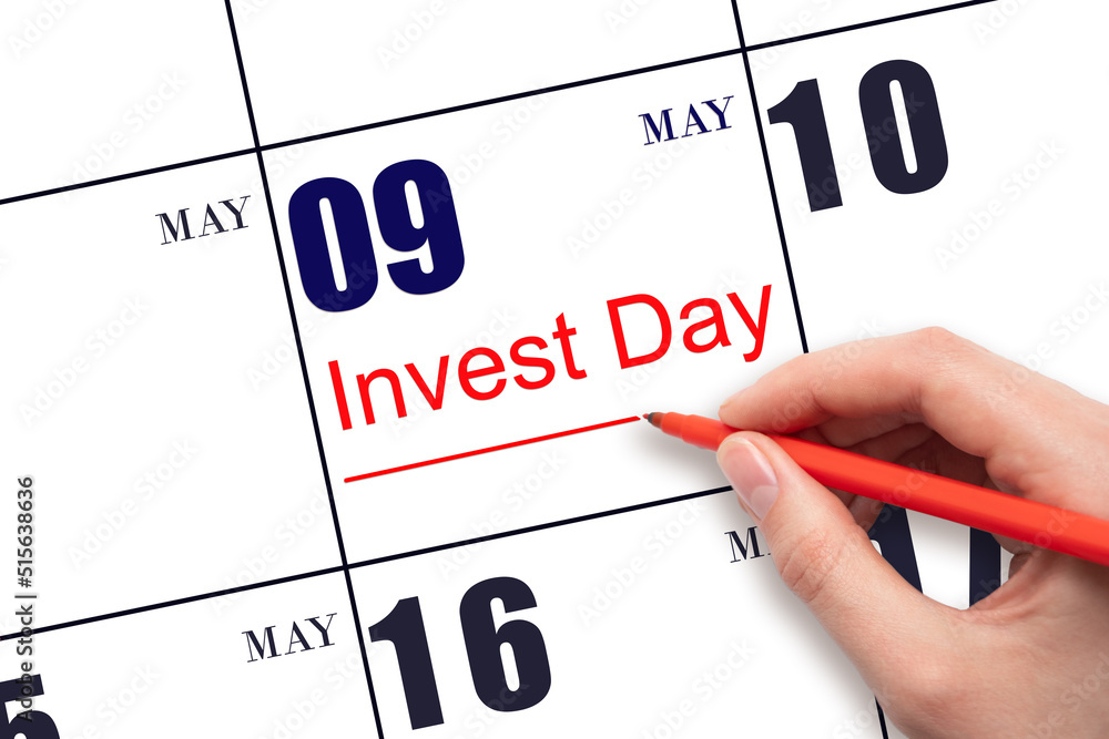 Hand drawing red line and writing the text Invest Day on calendar date May 9. Business and financial concept. Hand drawing red line and writing the text Invest Day on calendar date May 9. Business and financial concept.
