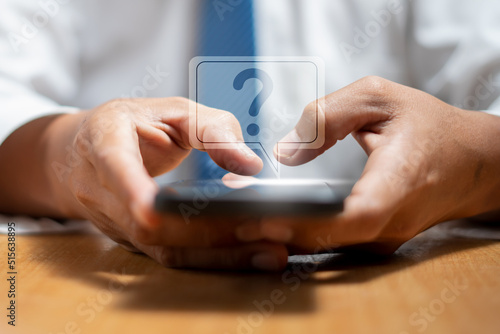 Man use smartphone with a question mark infographic.