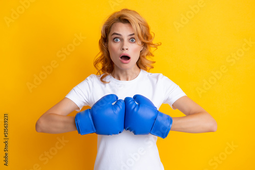 Surprised female boxer. Woman in boxing gloves. © Olena