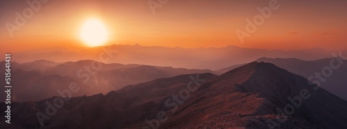 Beautiful sunset over Taurus Mountains from the top of Tahtali Mountain near Kemer, Antalya, Turkey photo