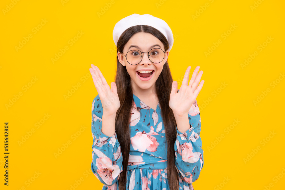 Excited teenager, amazed and cheerful emotions. Teenager child girl with shocked facial expression. Surprised face expression, isolated on yellow background. Happy surprise. Excited teenager, amazed and cheerful emotions. Teenager child girl with shocked facial expression. Surprised face expression, isolated on yellow background. Happy surprise.