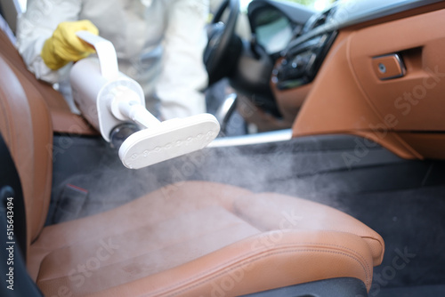Steam cleaning and disinfection of car interiors and car seats with steam cleaner