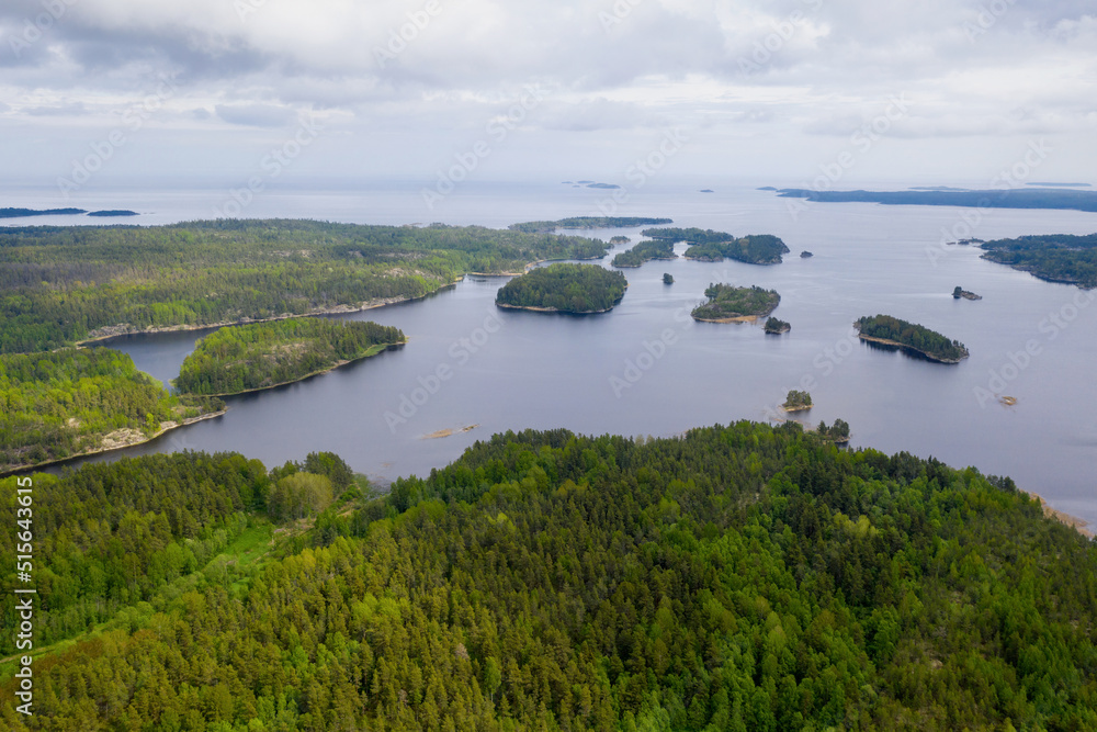 Obraz premium Aerial view of Ladoga Skerries National park on cloudy summer day. Surroundings of Harvia village, Karelia, Russia.