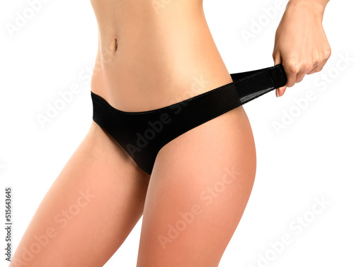 Feeling beautiful. Attractive young woman in underwear smiling while standing against white background.posing in black lingerie on a white background ,front view