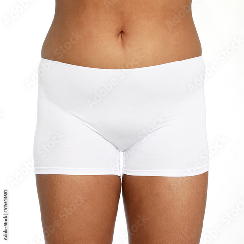 Woman with fat abdomen, overweight female body on white background, studio shot,posing in lingerie on a white background