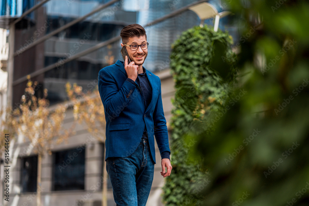 Cheerful businessman talking on mobile phone Cheerful businessman talking on mobile phone