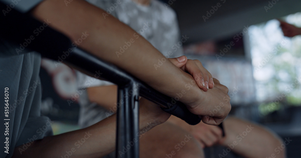 Relaxed friends communicating together in skate park with graffiti wall. 
