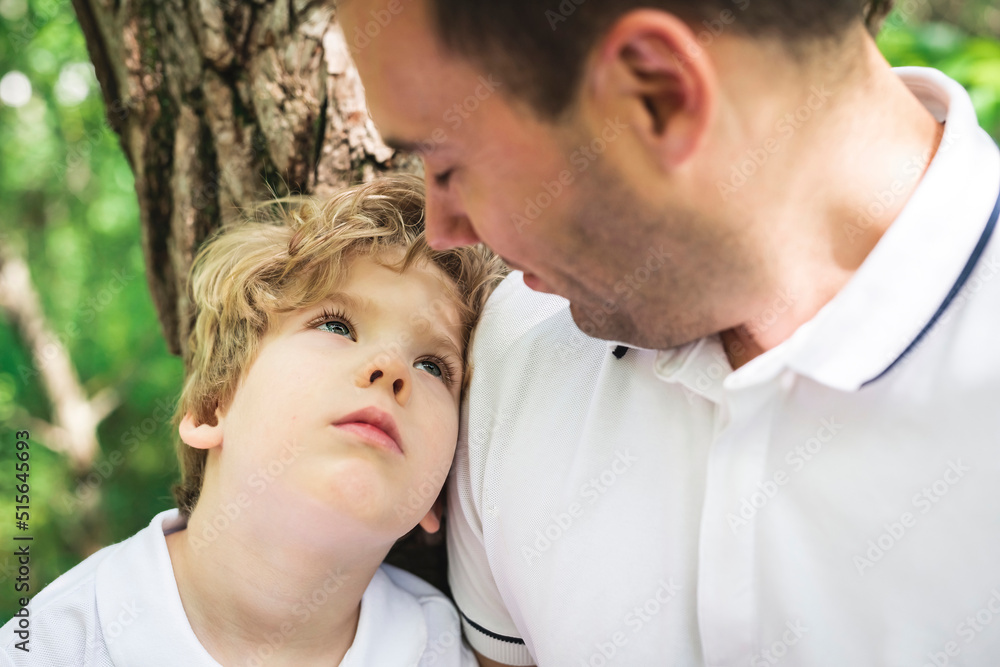 Fototapeta premium boy with father in summer park. Child in green woods