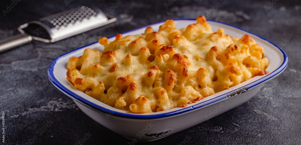 American mac and cheese, macaroni pasta in cheesy sauce American mac and cheese, macaroni pasta in cheesy sauce
