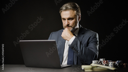 Print op canvas Businessman making online bet using laptop, gambling and fortune, investment