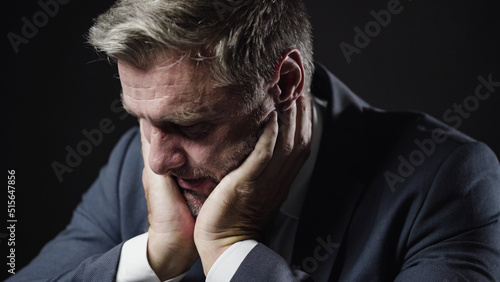 Fotografie Unhappy nervous man in business suit losing all his money and business, failure