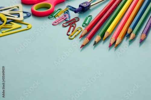 School supplies and office supplies on blue background. Learning, study, office equipment and presentation concept.
